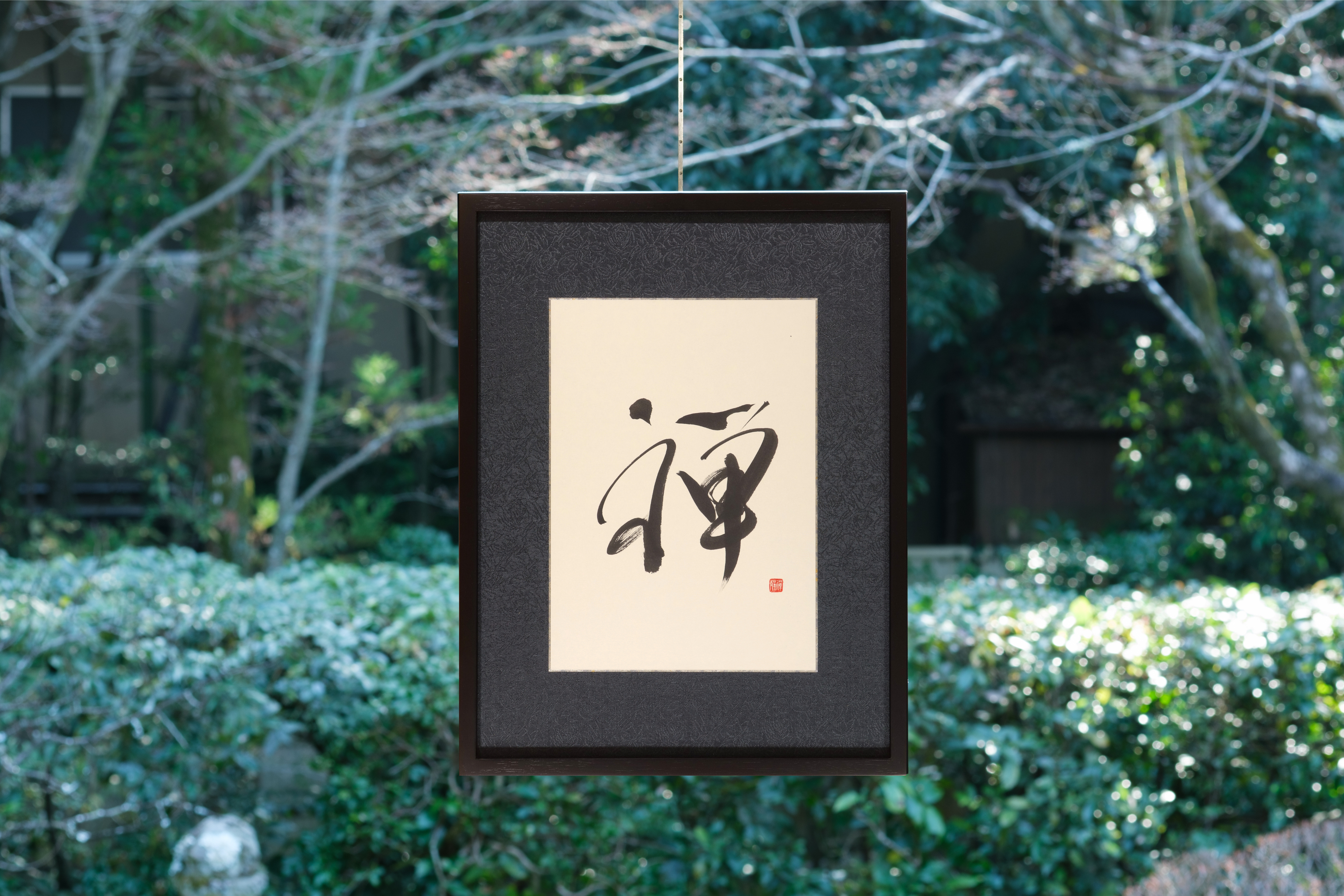 Artisan framed with Zen calligraphy